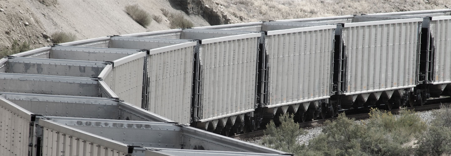 Railcars traveling through landscape